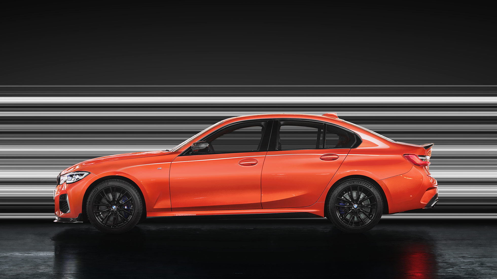 Rear view BMW M340i xDrive Sedan BMW M340i xDrive Sedan G20 Sapphire Black metallic rear view while driving